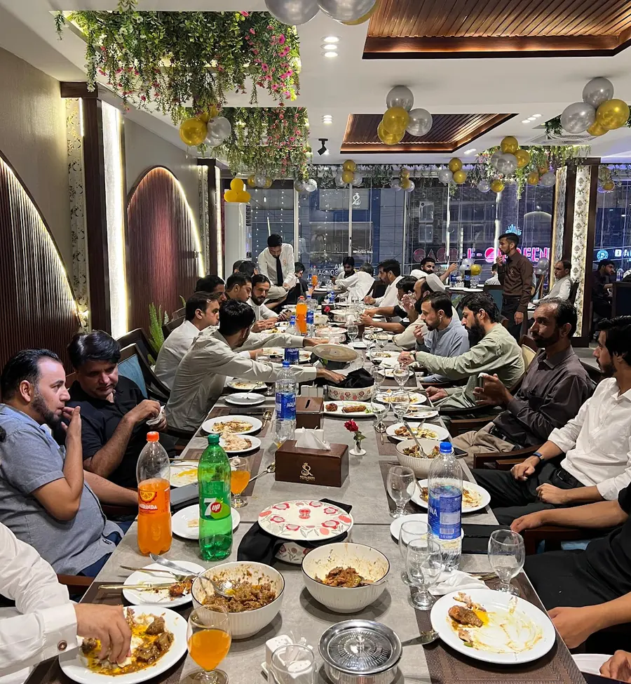 Guests at a long table during an event at Royal Sofra